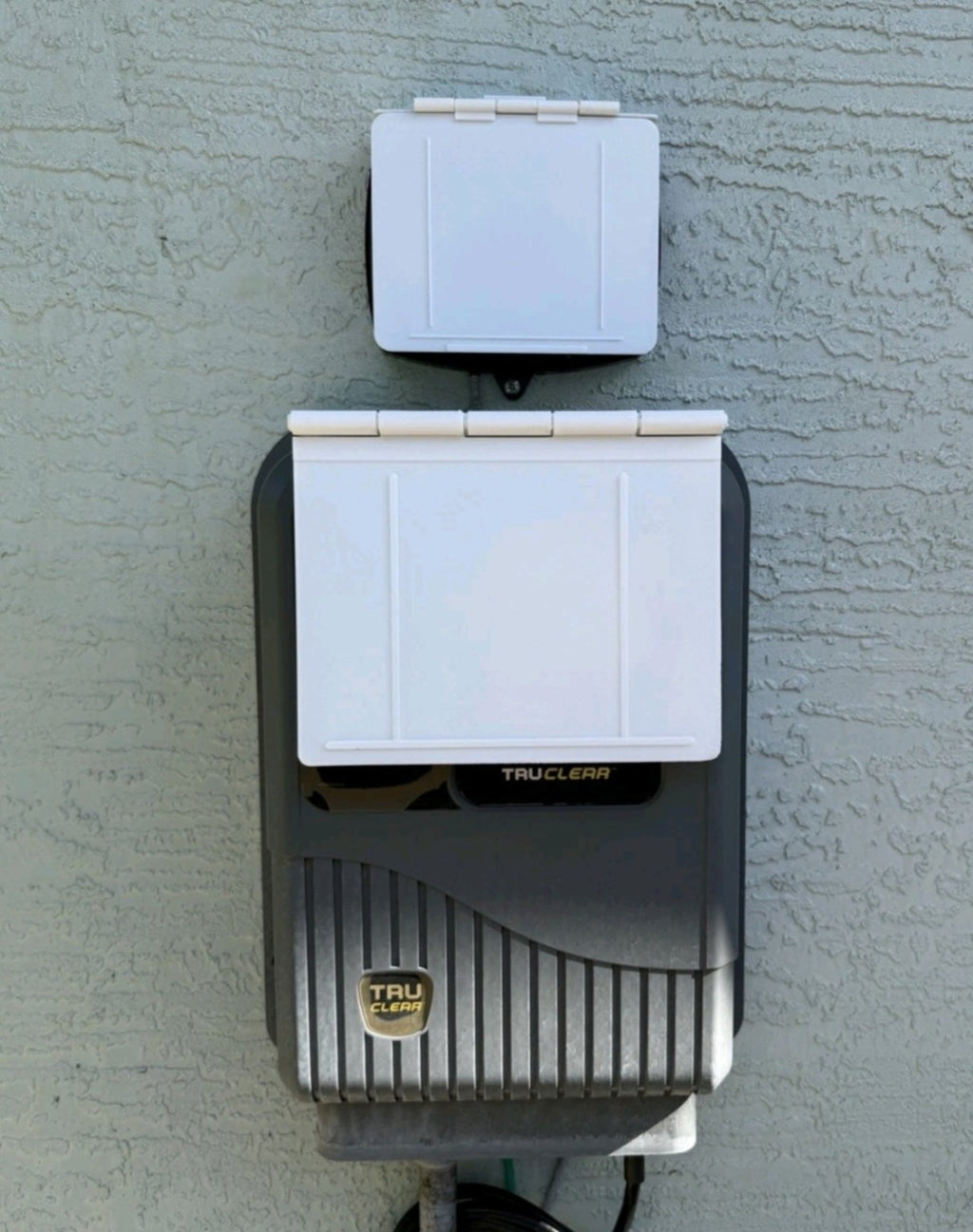 Customer installation showing MRKSENS white hinged covers on Jandy JEP-R controller and TruClear Power Center